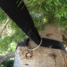 Load image into Gallery viewer, black tree saver around a pine tree
